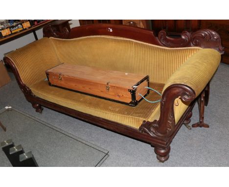 A Victorian mahogany scroll end sofa, with carved crest rail, 212cm wide 