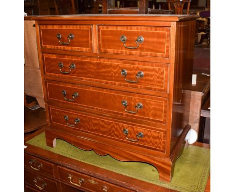 A Georgian style mahogany and crossbanded chest of drawers, two short over three long drawers, bracket supports, 76cm by 41cm