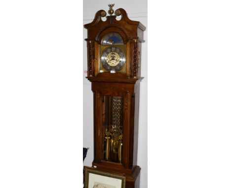 A Kieninger strike-silent oak cased longcase clock, the arched dial with silvered chapter ring, 53cm by 29cm by 222cm high 