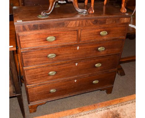 An early 19th century mahogany chest of two short over three long graduated drawers, oval gilt metal handles, bracket support