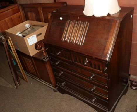 A 20th century oak metamorphic Monk's bench, with linen-fold panels, 94cm by 55cm deep; together with a similar oak bureau, 7