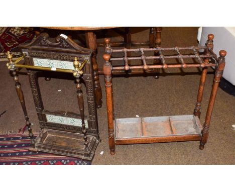 A Victorian cast-iron and tiled stick stand, 44cm by 20cm by 74cm high; together with an early 20th century turned oak 12-div