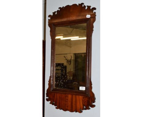 A George III mahogany Irish mirror, bearing label of Robert Strahan &amp; Co Dublin, the tarnished mirror plate within a moul