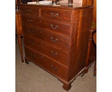 A George III Provincial oak chest of drawers, two short over four long graduated drawers, on bracket feet, 101cm by 47cm by 1