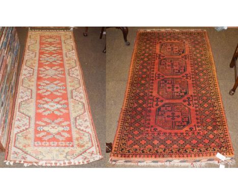 A Melas runner, the terracotta field of stylised flowers enclosed by borders of angular stylised vines, 270cm by 81cm, togeth