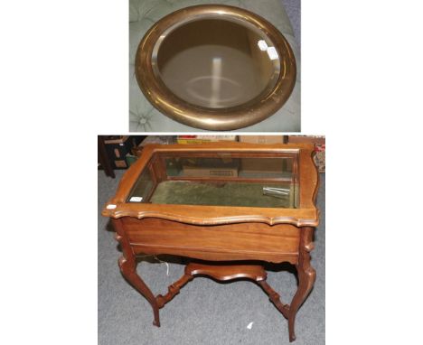 A mahogany bijouterie table with shelf stretcher and a brass mirror, 68cm by 44cm by 72cm, mirror 42cm diameter  