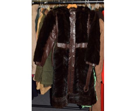 Brown leather and chevron cut mink coat, with press stud fastening, fur collar and matching leather belt.    Rubbing and wear