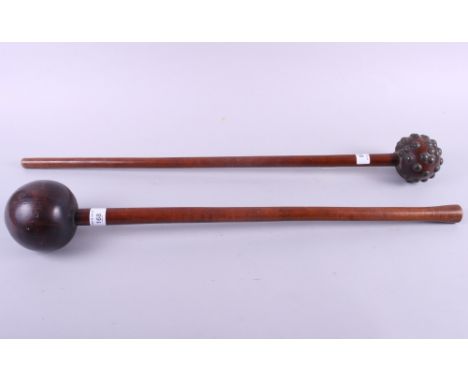 A South African knobkerrie with metal studs, 28" long, and a South African knobkerrie with shaped grip, 26" long