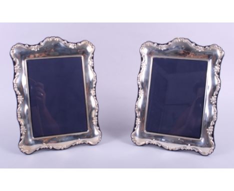 A pair of Carrs embossed silver mounted easel photo frames, 10 1/2" high overall