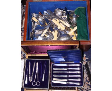 A quantity of silver plated cutlery, including a ladle, dinner forks, knives, mother-of-pearl handled cutlery and other items