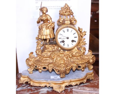 A Continental gilt metal mantel clock with white enamel dial and Arabic numerals, on stand, 13" high overall