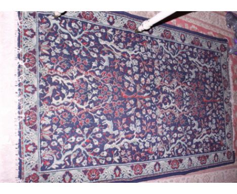 A Persian prayer mat decorated hanging lamp to mihrab on a brown ground with frieze panel decorated buildings, 40" x 26" appr
