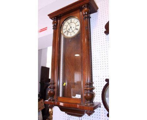 A mahogany cased wall clock with white enamel dial and Arabic numerals