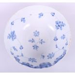 An early 18th century English delfware punch bowl, decorated flowers, 10" dia