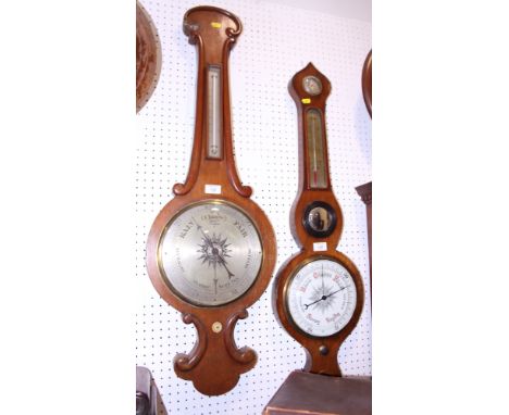 An oak cased barometer and another with a circular central mirror