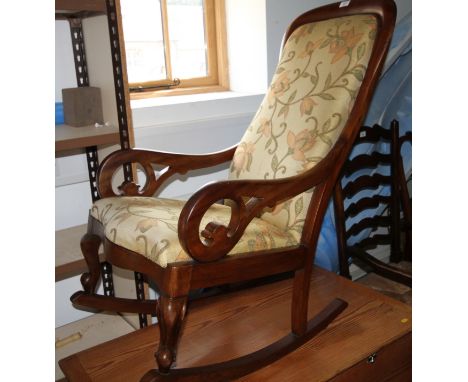 A Victorian mahogany scroll frame rocking chair with drop-in seat, an ash ladder back chair with rush envelope seat, on turne