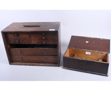 A seven-drawer tool chest containing callipers, clock and watch parts, pliers, tweezers and miscellaneous tools, together wit