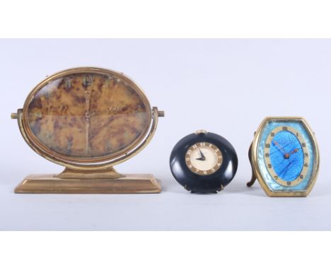 An Art Deco brass cased mantel clock with faux tortoiseshell dial, a brass cased travel alarm clock and a Westclox travelling