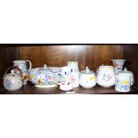 A 1950s Poole bowl with floral decoration, six preserve jars and cover, a jug and a number of
