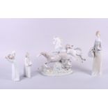 A Lladro group of two galloping horses, 12" high (restored) and a Lladro figure of a girl carrying a