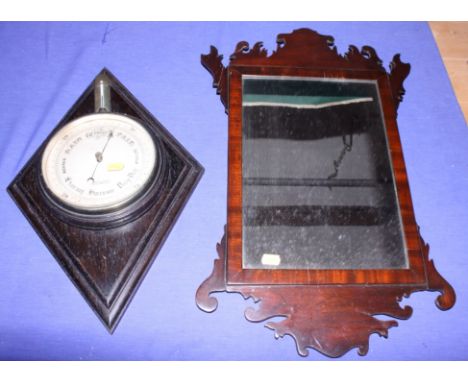 An early 20th century mahogany framed mirror and a John Lennie barometer