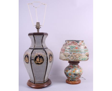 A table lamp with figure decorated panels and a leather lamp