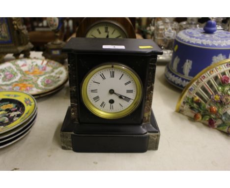 A black slate and marble single hole mantel clock 