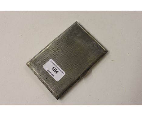 A silver engine turned cigarette case 