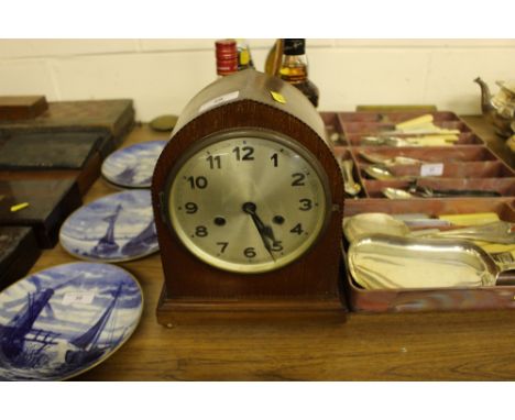 An Edwardian mahogany and inlaid two hole mantel clock of lancet form