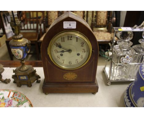 An Edwardian mahogany and inlaid two hole mantel clock of lancet form 