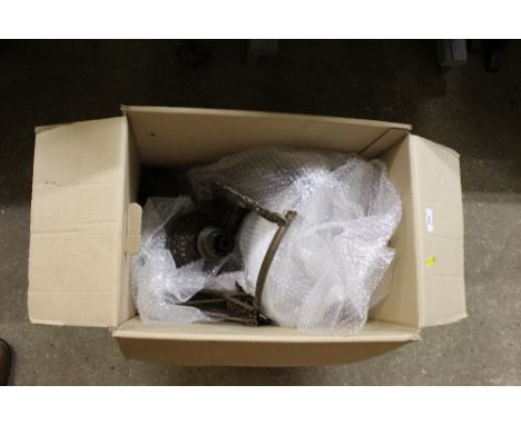 A box containing a hanging oil lamp 