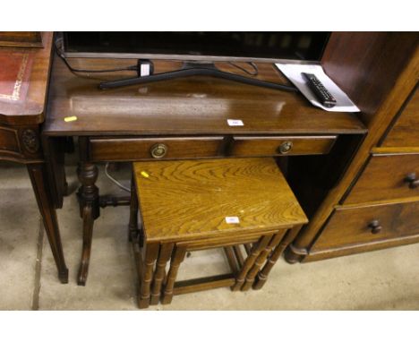 A reproduction mahogany drop leaf sofa table