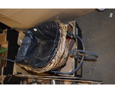 Wicker wheelbarrow shaped planter and assorted tools