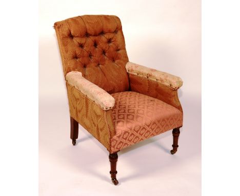 A Victorian upholstered armchair, with button back, raised on turned mahogany supports, 97cm high x 69cm wide x 67cm deep 