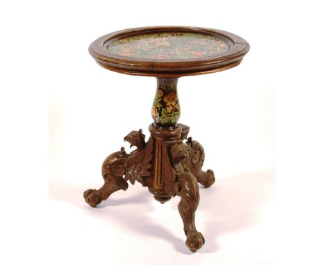 A Spanish walnut and majolica tripod table, circa 1880, with pottery top above baluster stem and carved ball and claw support