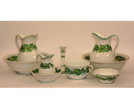 A Minton toilet set, comprising of two wash bowls, two jugs, small bowl and jug, candlestick, chamber pot and small bowl (9)