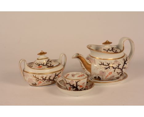 A porcelain teaset, circa late 18th century, decorated with Imari coloured foliate panels, comprising of teapot on stand, suc