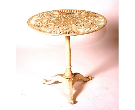 A Victorian painted iron table, circa mid 19th century, with pierced circular top and tripod base, 72cm high x 71cm diameter 
