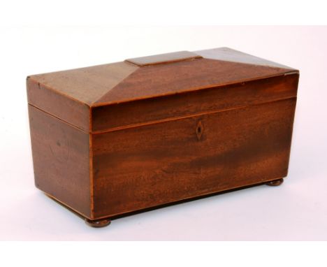 A Regency mahogany sarcophagus tea caddy, circa early 19th century, with two integral boxes, lacking mixing glass and one bun