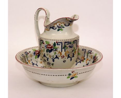 A Corona ware pottery toilet jug with matching basin, jug 33cm high, bowl 42cm diameter (2)