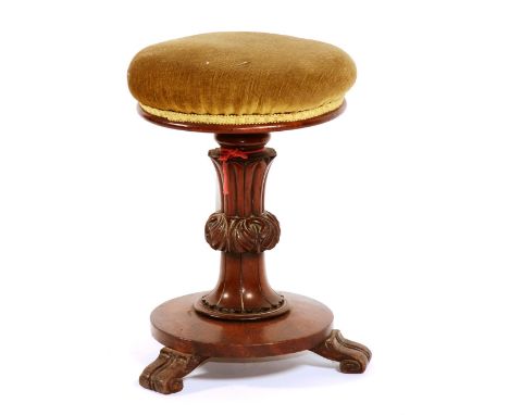 A Victorian mahogany revolving piano stool, the round green upholstered seat on fluted carved support and tripod base, 48cm h