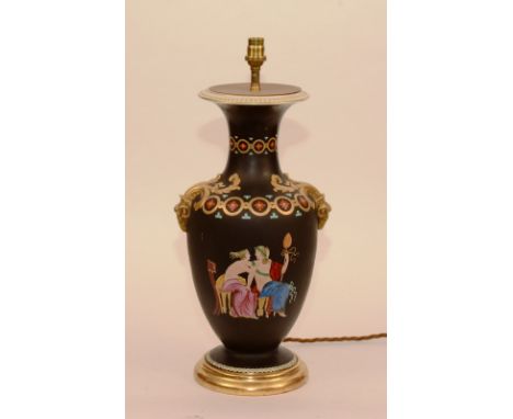 A Greek Revival vase lamp by Bells of Glasgow, circa 1880, decorated in neo-classical style on black ground, raised on giltwo