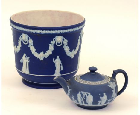 A Wedgwood Jasperware blue and white planter, decorated with classical figures, fruit and vines, with lion mask finials, 19cm
