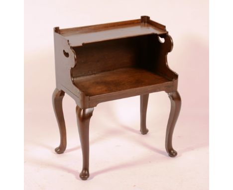 A George III style mahogany bedside table, circa early 19th century, with shelf above open recess, raised on cabriole support