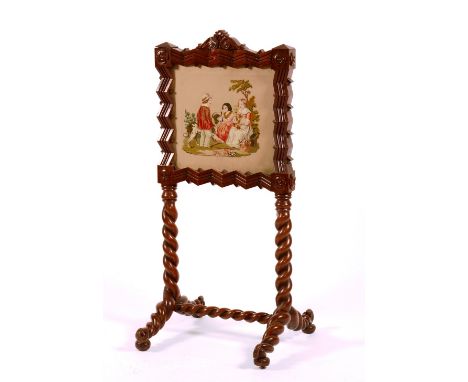 A William IV mahogany firescreen, circa 1835, attributed to Thomas Hopper, with chevron decoration and needlework panels, 125