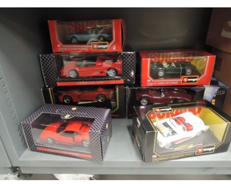 Seven Burago and Shell 1:18 and 1:24 scale diecasts, Ferraris, Corvette and Ford sports cars, all boxed