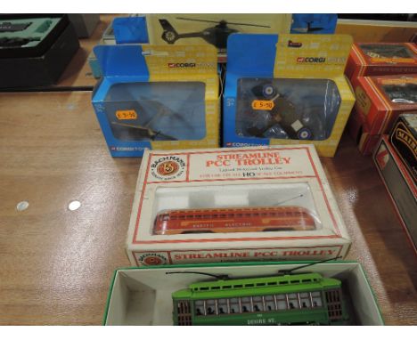 A Bachmann HO scale Streamline PCC Trolley, a similar tram, four Corgi fighter planes and a Wiking helicopter. All boxed