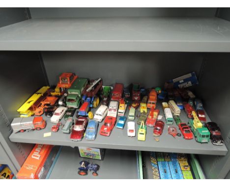 A shelf of mixed playworn diecasts including Corgi, Dinky, Matchbox etc