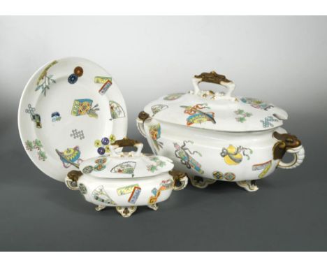 A Royal Worcester Aesthetic Movement part dinner service, the tureens with elephant mask handles and grotesque bird feet fini