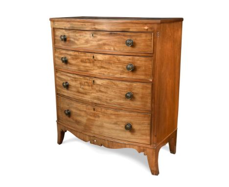 A Regency mahogany bow front chest, of four graduated long drawers, inlaid with boxwood motifs, on splayed bracket feet 120 x